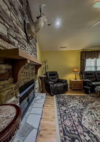 a living room with furniture and a fireplace