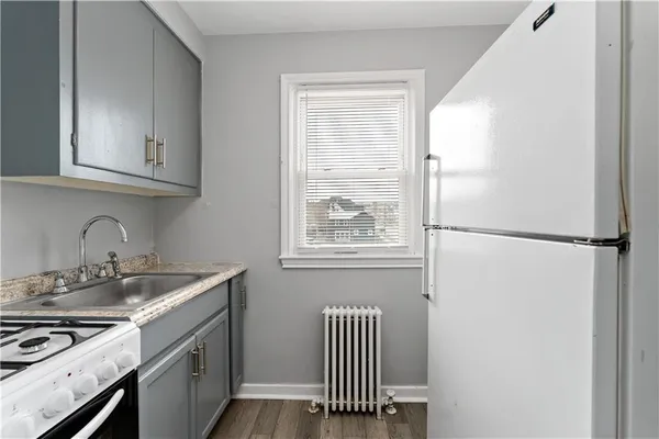 a kitchen with a stove and a refrigerator
