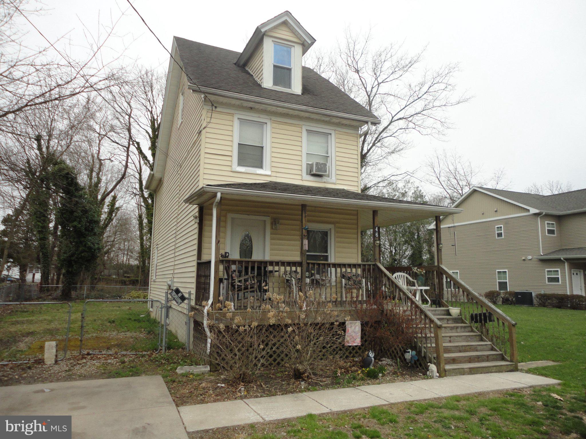 46 Ellis Street Bridgeton, NJ 08302 - Photo 5 of 8 front view of house with a yard