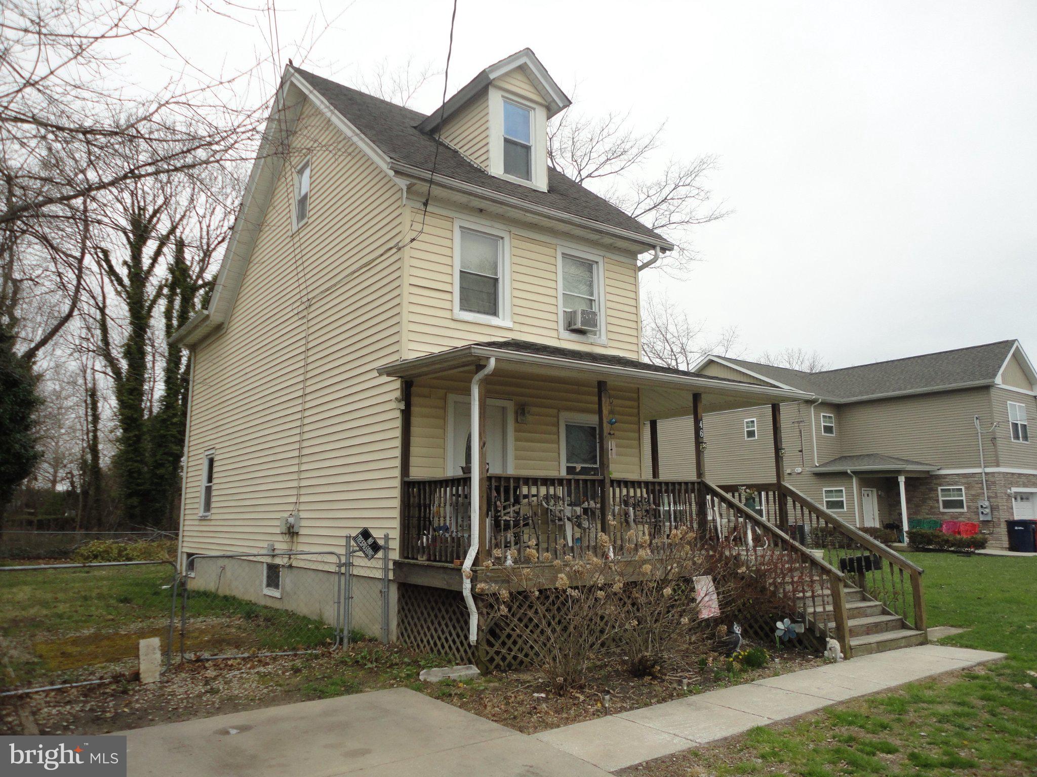 46 Ellis Street Bridgeton, NJ 08302 - Photo 6 of 8 a front view of a house with a yard