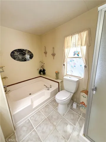 a bathroom with a toilet a sink and a bathtub