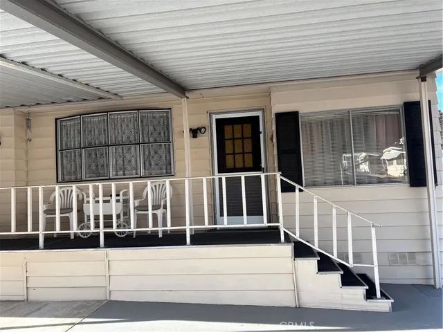 a view of staircase with white walls and windows
