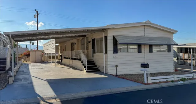 a view of a living room and entryway
