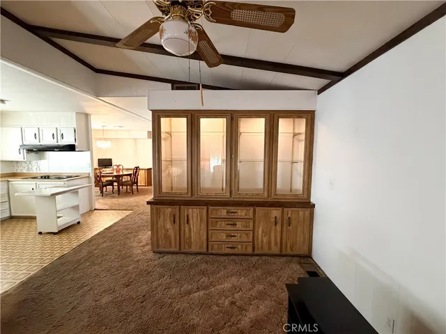a view of a kitchen with furniture and a window