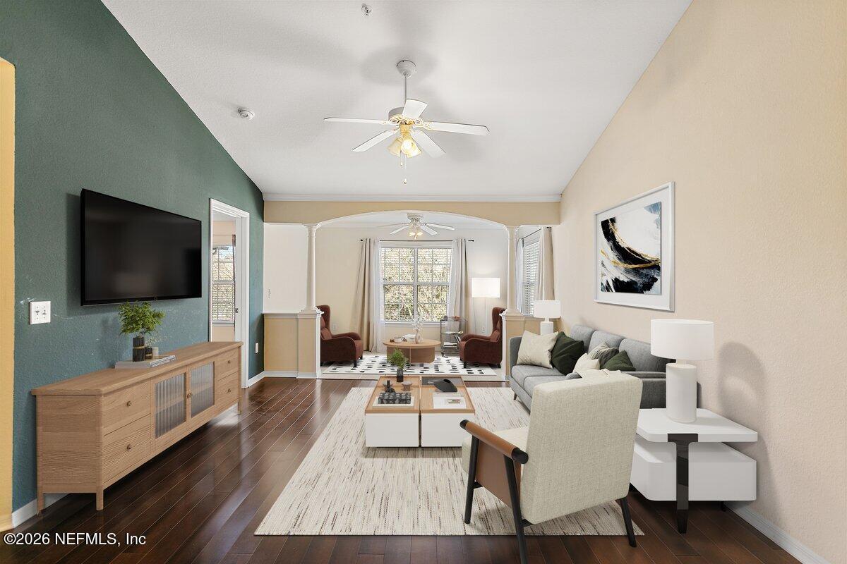10961 Burnt Mill Road, Unit 333 Jacksonville, FL 32256 - Photo 2 of 21 a living room with furniture and a flat screen tv