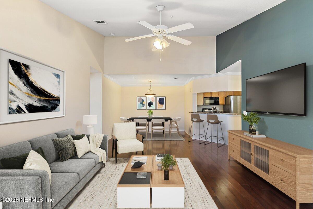 10961 Burnt Mill Road, Unit 333 Jacksonville, FL 32256 - Photo 3 of 21 a living room with furniture and a flat screen tv