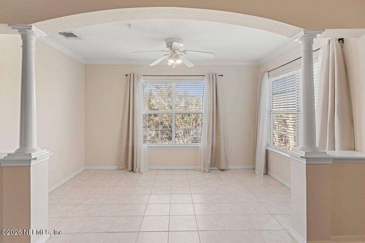 10961 Burnt Mill Road, Unit 333 Jacksonville, FL 32256 - Photo 4 of 21 a view of an empty room with a window