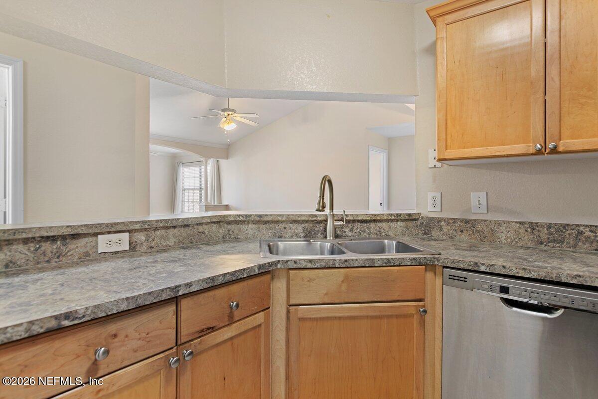 10961 Burnt Mill Road, Unit 333 Jacksonville, FL 32256 - Photo 6 of 21 a kitchen with stainless steel appliances granite countertop a sink and a cabinets
