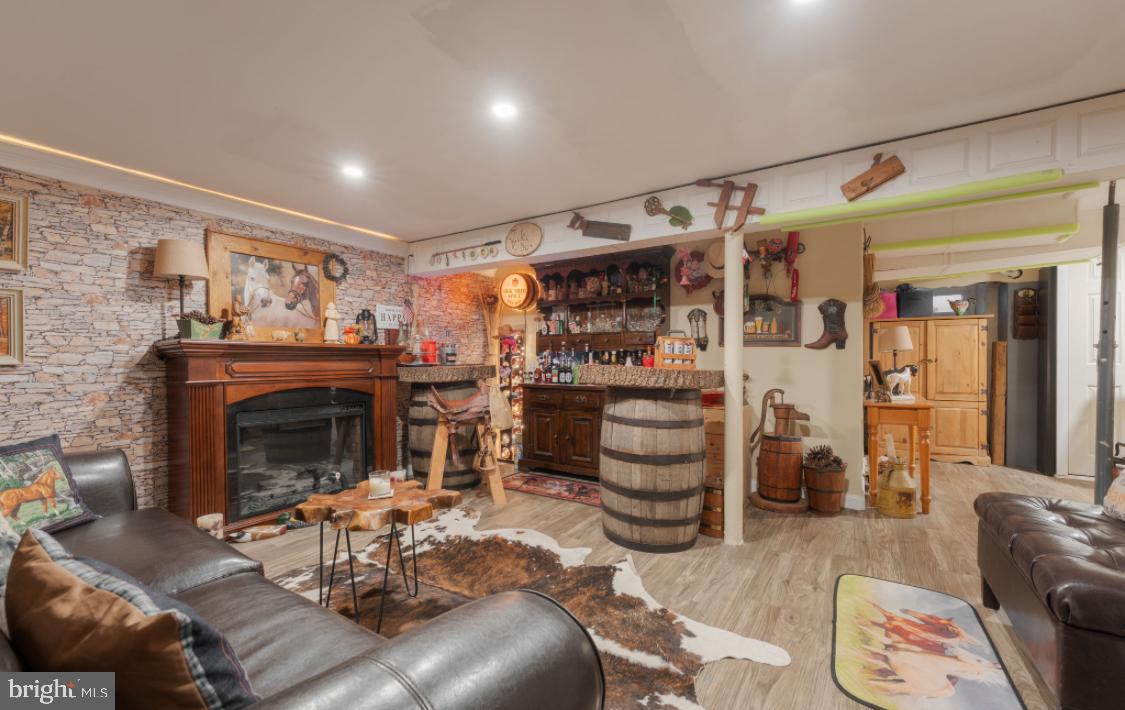 914 Thornton Road Upper Chichester, PA 19061 - Photo 12 of 29 a living room with furniture and a fireplace