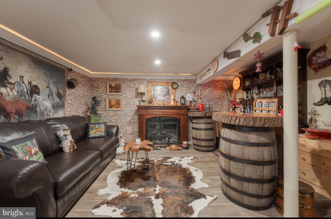 914 Thornton Road Upper Chichester, PA 19061 - Photo 13 of 29 a living room with furniture and a fireplace
