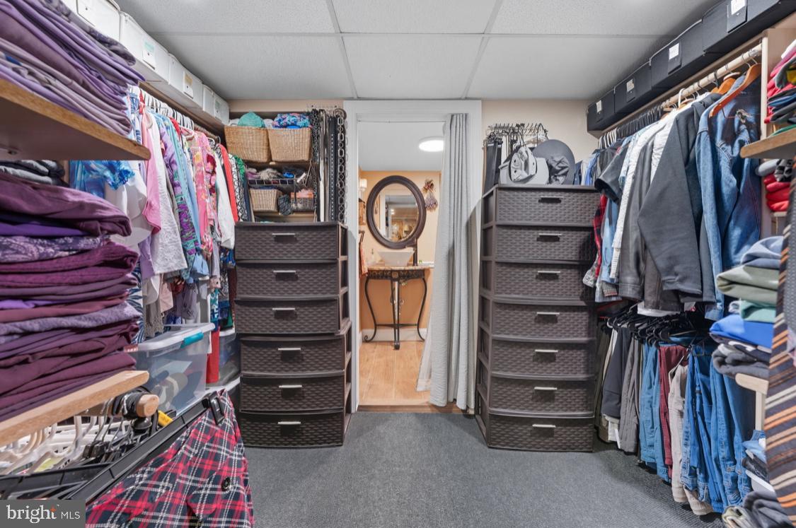914 Thornton Road Upper Chichester, PA 19061 - Photo 14 of 29 a view of walk in closet with clothes and shoes