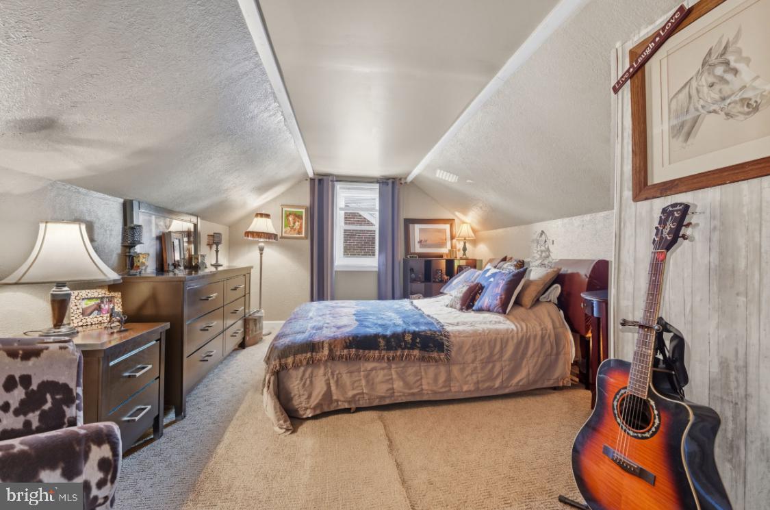 914 Thornton Road Upper Chichester, PA 19061 - Photo 20 of 29 a bedroom with a bed and wooden floor