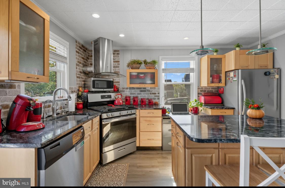 914 Thornton Road Upper Chichester, PA 19061 - Photo 2 of 29 a kitchen with stainless steel appliances granite countertop a sink and a refrigerator