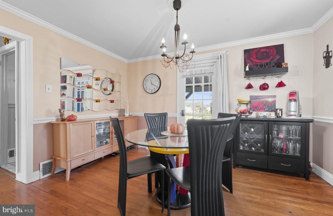 914 Thornton Road Upper Chichester, PA 19061 - Photo 6 of 29 a view of a dining room with furniture and wooden floor