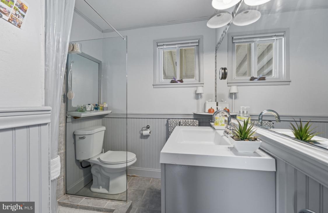 914 Thornton Road Upper Chichester, PA 19061 - Photo 10 of 29 a bathroom with a sink toilet and mirror