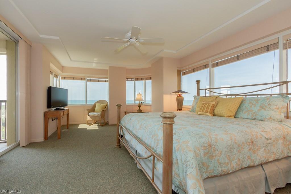 6825 Grenadier Boulevard, Unit 1505 Naples, FL 34108 - Photo 16 of 35 a bed room with two bed and a television