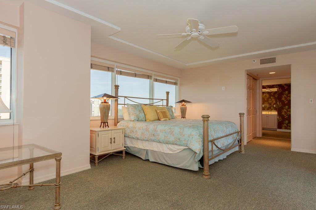 6825 Grenadier Boulevard, Unit 1505 Naples, FL 34108 - Photo 17 of 35 a bed room with a bed and window