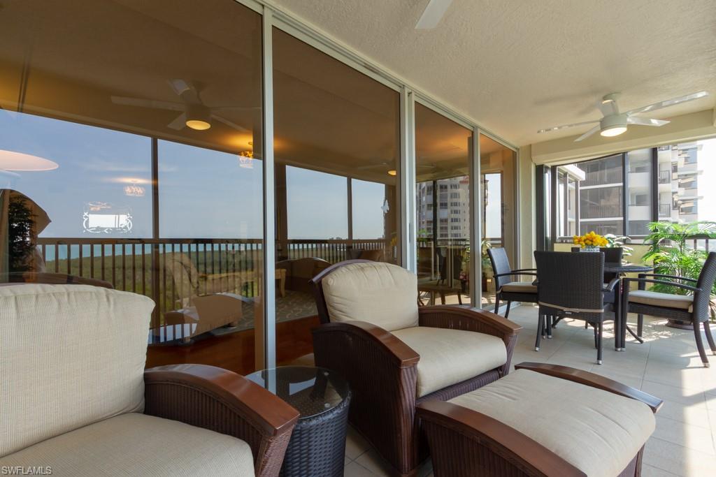 6825 Grenadier Boulevard, Unit 1505 Naples, FL 34108 - Photo 31 of 35 a living room with furniture and a potted plant