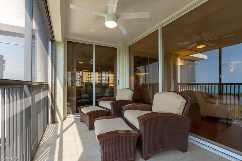 6825 Grenadier Boulevard, Unit 1505 Naples, FL 34108 - Photo 32 of 35 a living room with furniture and a window
