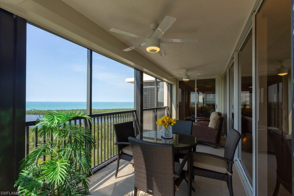 6825 Grenadier Boulevard, Unit 1505 Naples, FL 34108 - Photo 34 of 35 a dining room with furniture and garden view