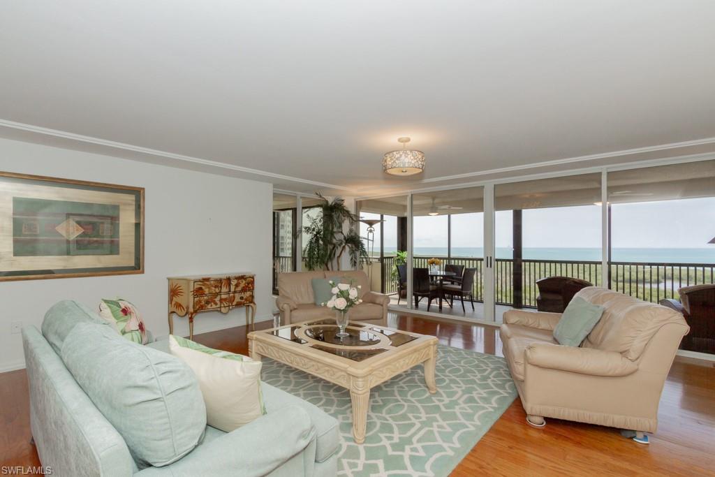 6825 Grenadier Boulevard, Unit 1505 Naples, FL 34108 - Photo 5 of 35 a living room with furniture and a large window