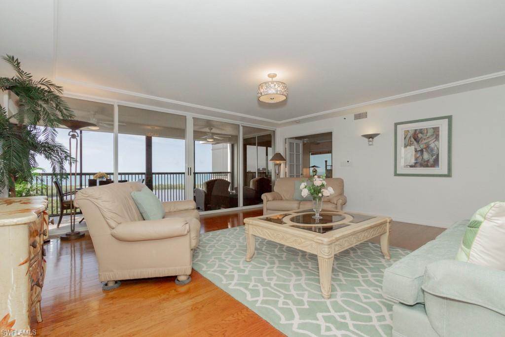 6825 Grenadier Boulevard, Unit 1505 Naples, FL 34108 - Photo 6 of 35 a living room with furniture and a large window