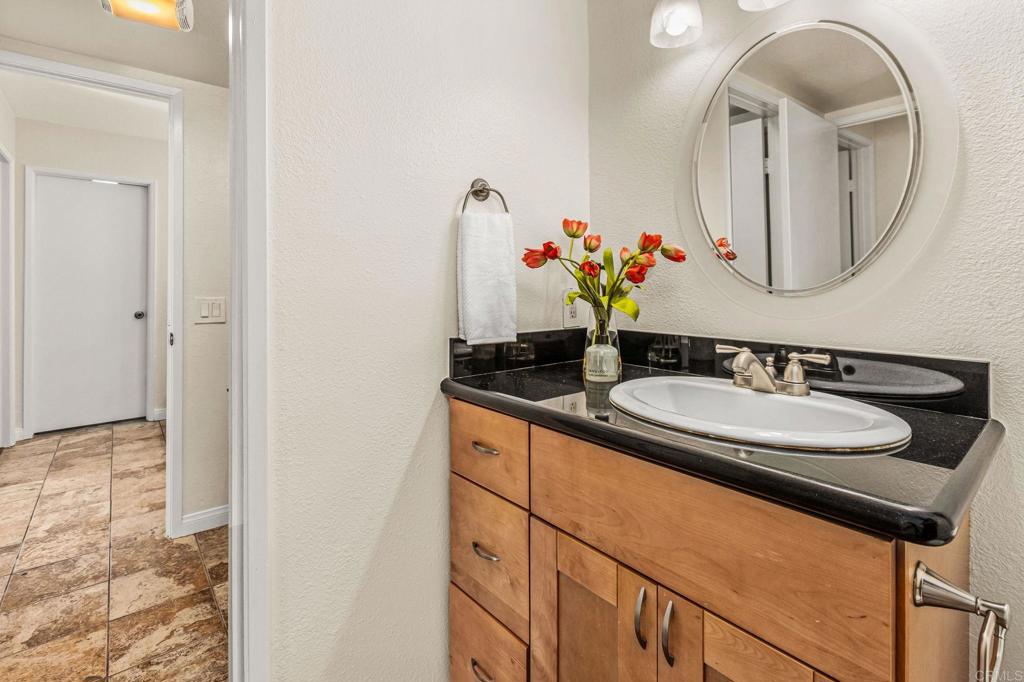 2920 Briarwood Road, Unit I1 Bonita, CA 91902 - Photo 16 of 24 a bathroom with a sink and a mirror