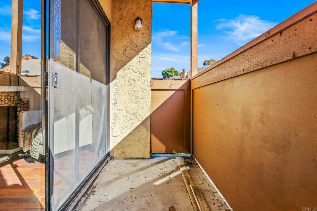 2920 Briarwood Road, Unit I1 Bonita, CA 91902 - Photo 18 of 24 a view of balcony with wooden floor and fence