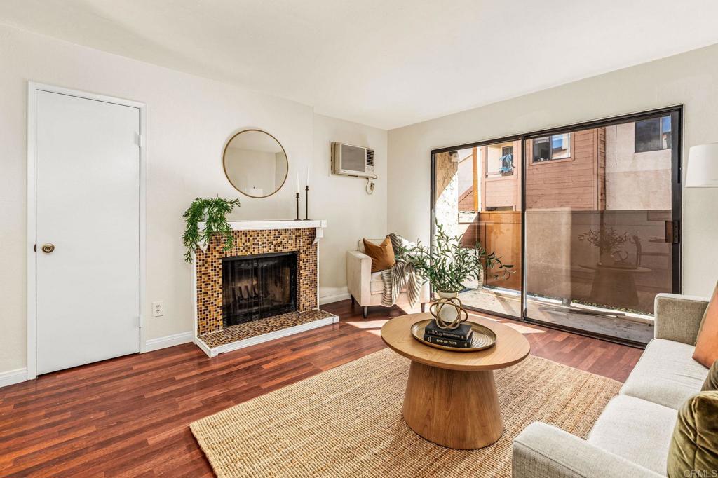 2920 Briarwood Road, Unit I1 Bonita, CA 91902 - Photo 2 of 24 a living room with furniture a window and a fireplace