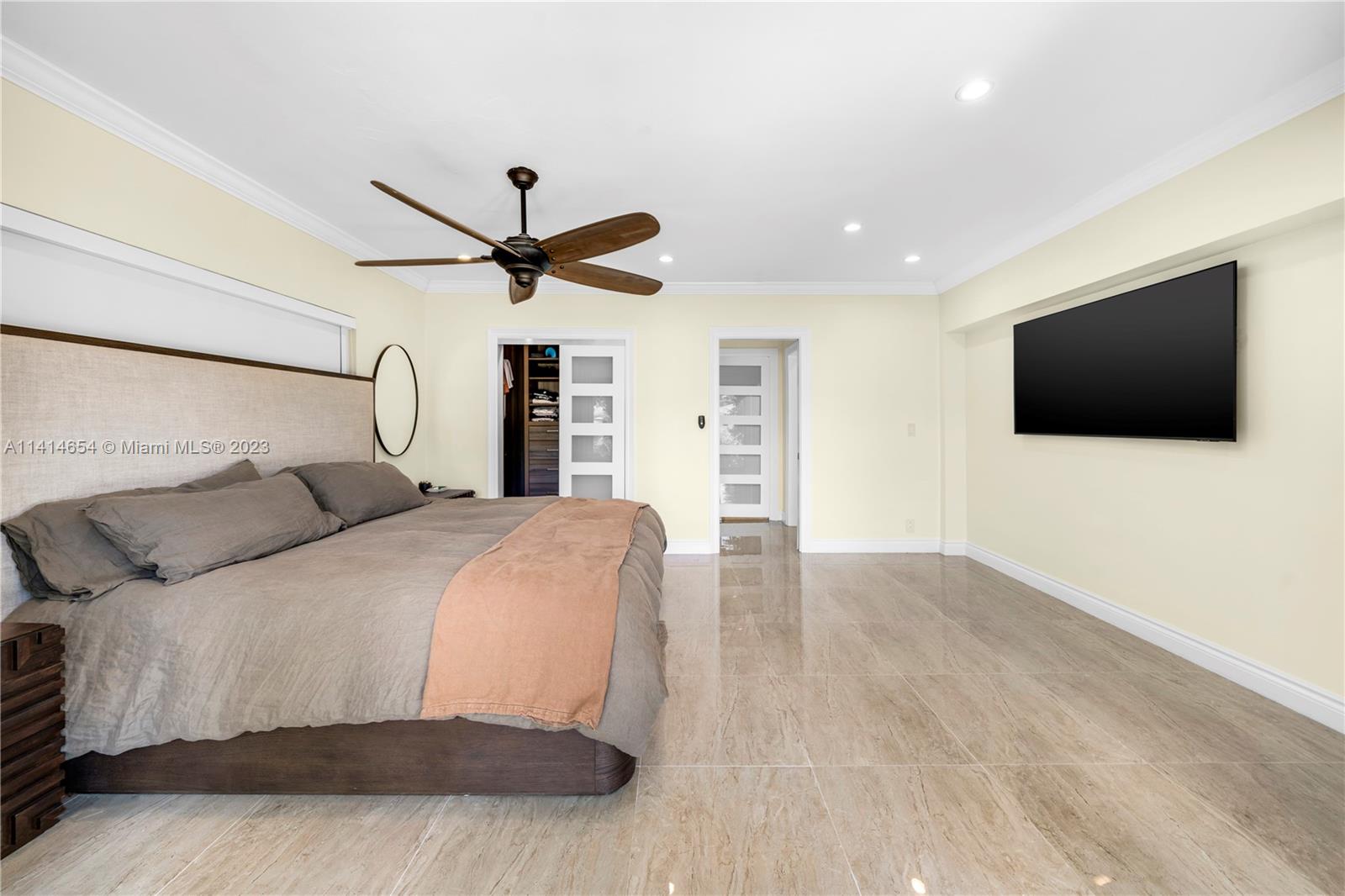 1160 Northeast 91st Street Miami, FL 33138 - Photo 15 of 33 a bedroom with a bed and a flat screen tv