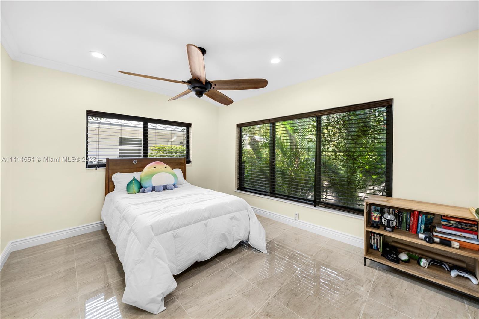 1160 Northeast 91st Street Miami, FL 33138 - Photo 17 of 33 a bedroom with a bed and a large window