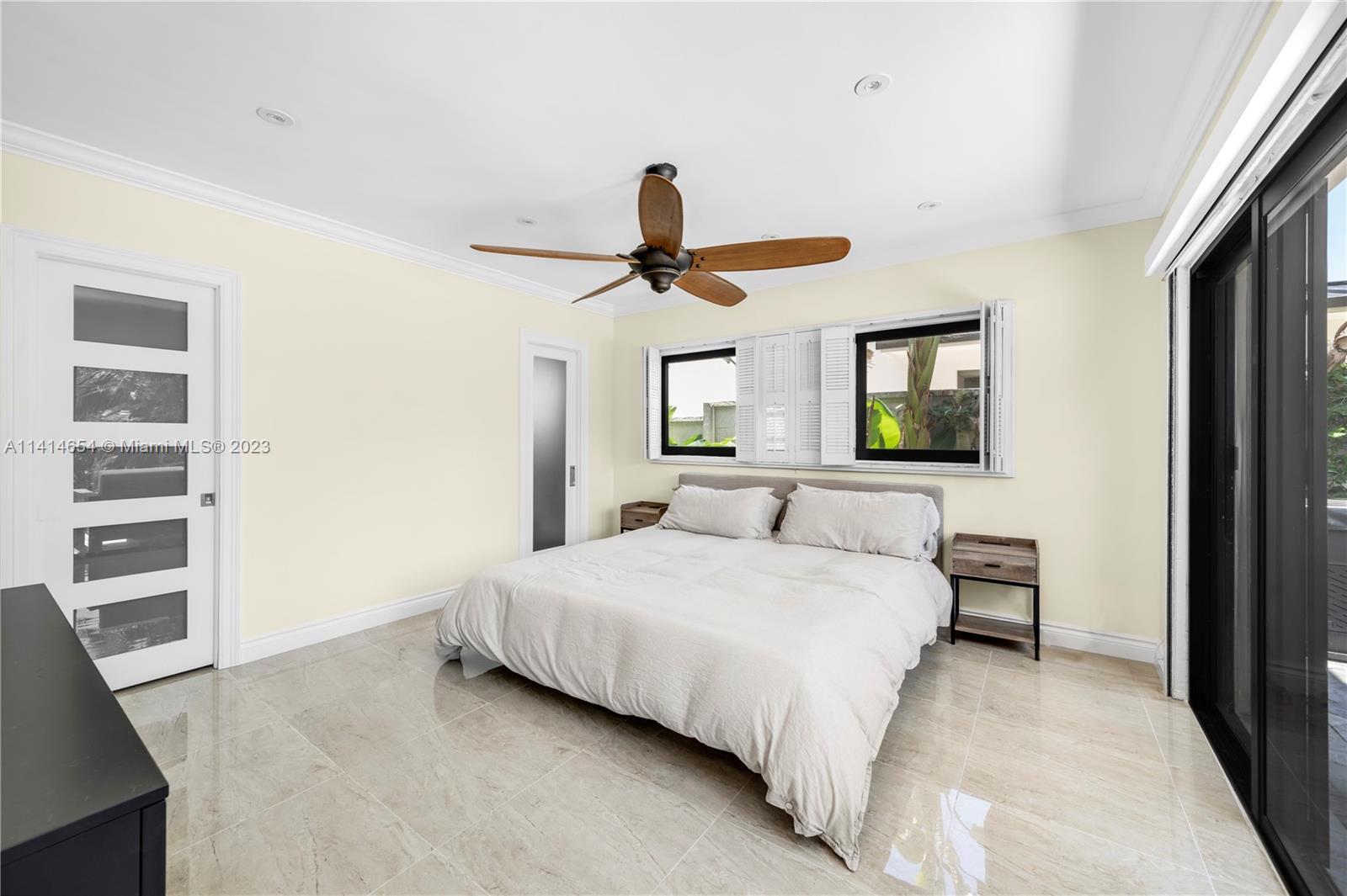 1160 Northeast 91st Street Miami, FL 33138 - Photo 21 of 33 a bedroom with a bed and a window