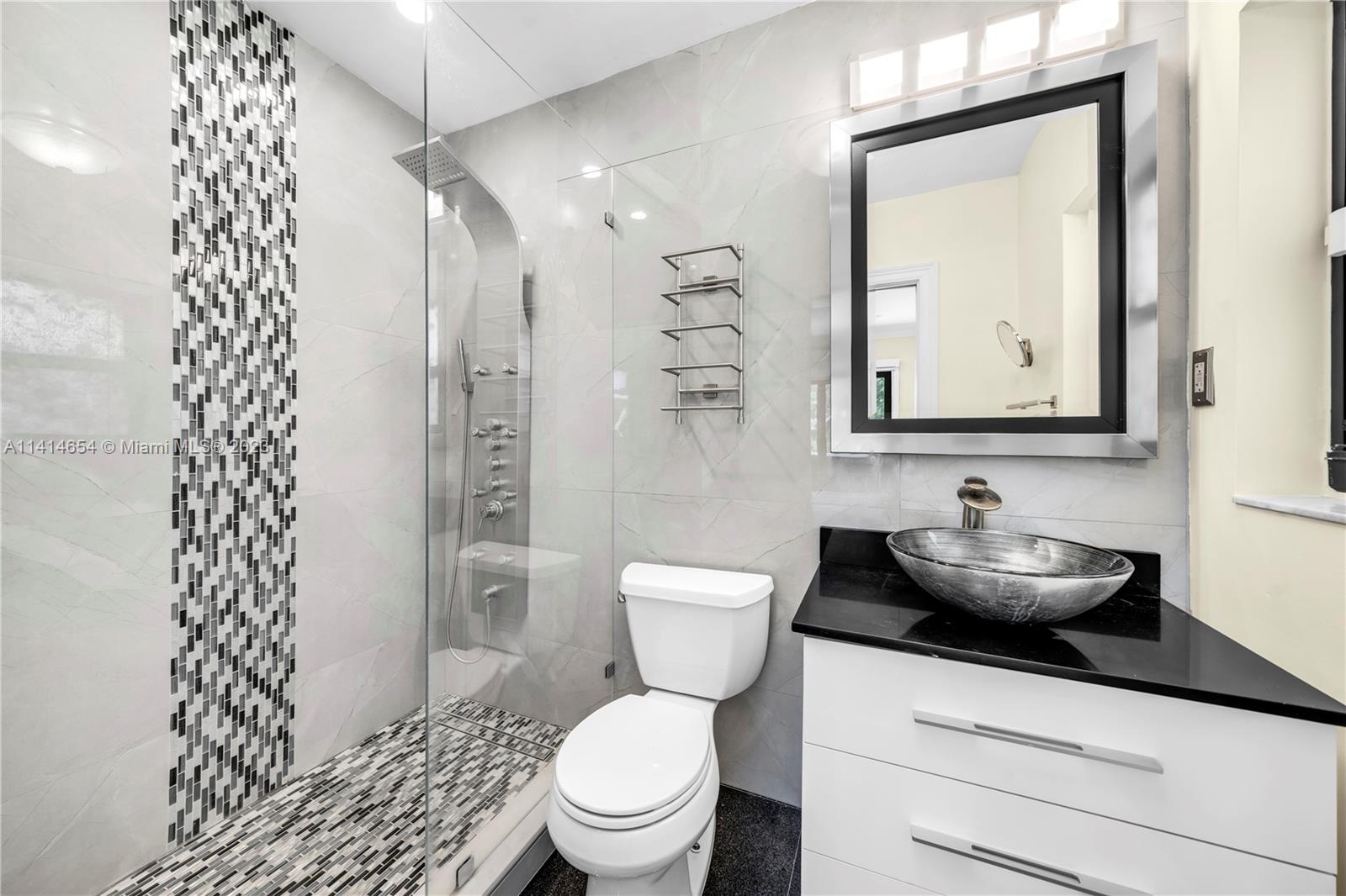 1160 Northeast 91st Street Miami, FL 33138 - Photo 23 of 33 a bathroom with a sink a toilet and shower