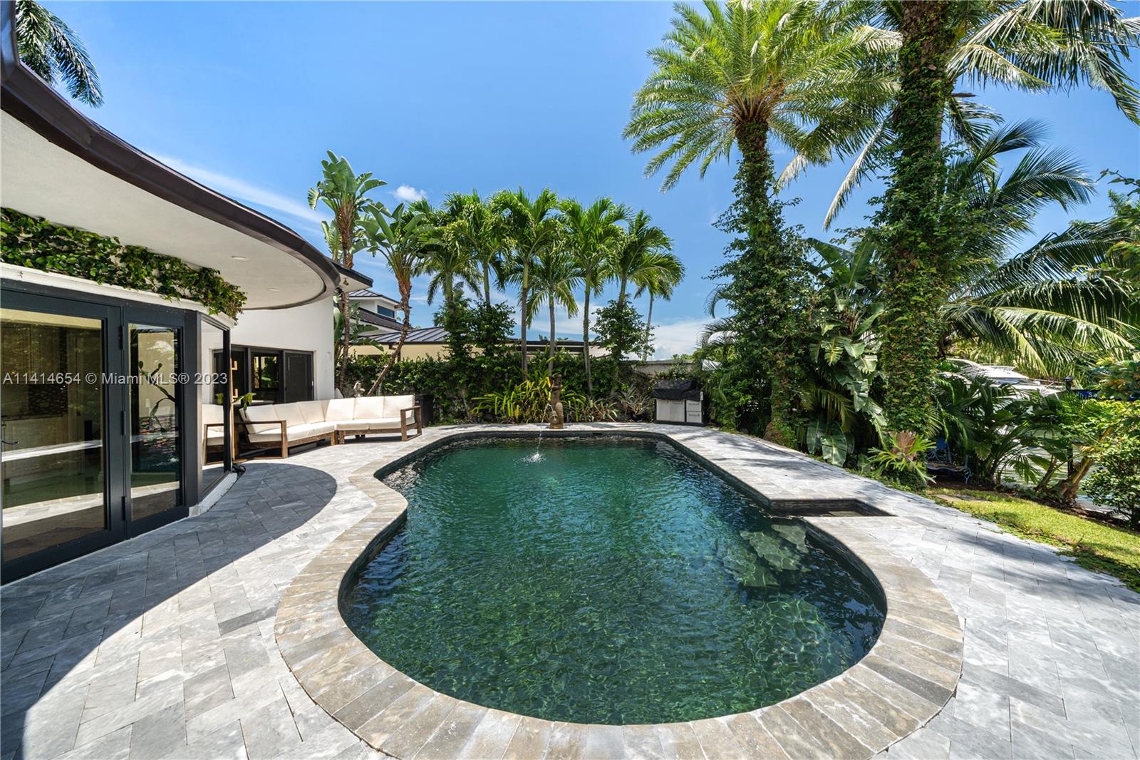 1160 Northeast 91st Street Miami, FL 33138 - Photo 24 of 33 a swimming pool with outdoor seating and yard