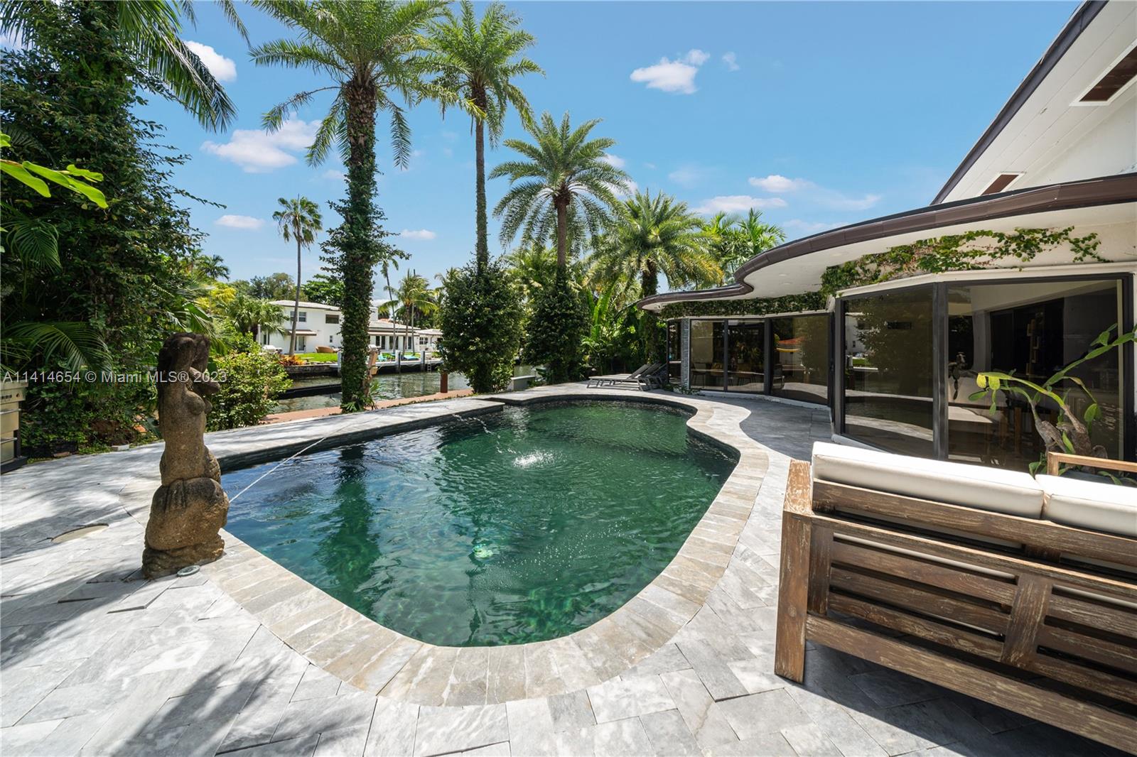 1160 Northeast 91st Street Miami, FL 33138 - Photo 25 of 33 a view of a swimming pool with a patio