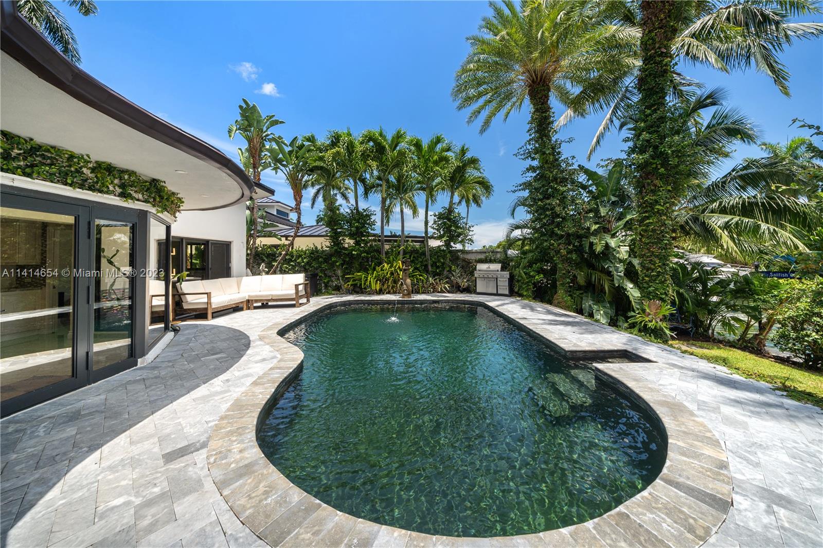 1160 Northeast 91st Street Miami, FL 33138 - Photo 27 of 33 a view of a swimming pool with a patio