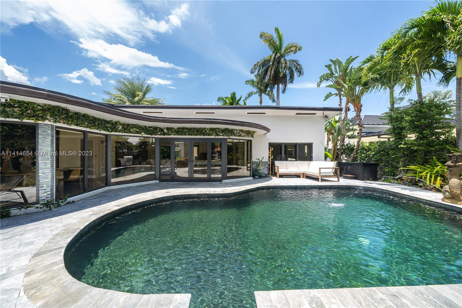 1160 Northeast 91st Street Miami, FL 33138 - Photo 29 of 33 a view of a house with swimming pool and sitting area