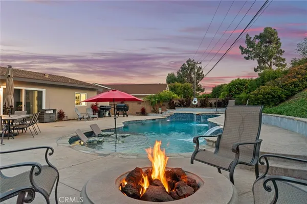 a view of a backyard with plants and a patio