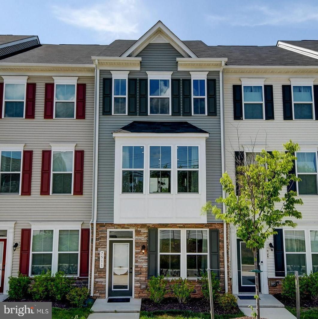 7511 Mundell Road Hanover, MD 21076 - Photo 1 of 26 a front view of a house with a yard