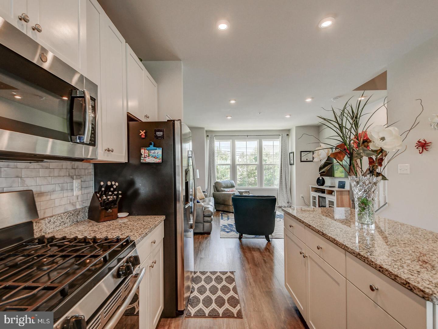 7511 Mundell Road Hanover, MD 21076 - Photo 16 of 26 Kitchen leading to Liv