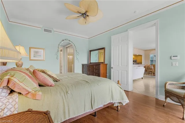 a bed room with a bed and a chandelier