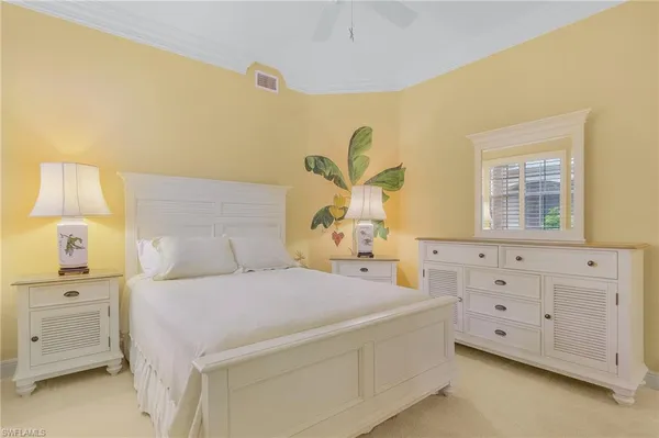 a bedroom with a bed and a cabinets