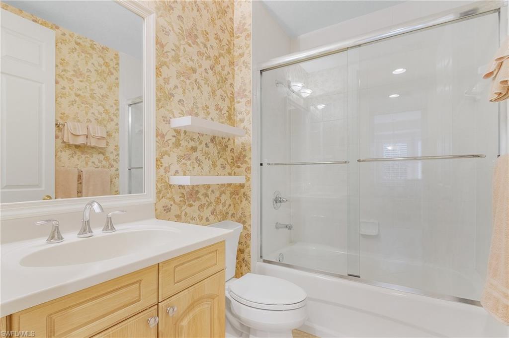 801 Regency Reserve Circle, Unit 4301 Naples, FL 34119 - Photo 15 of 26 a bathroom with a sink toilet and shower