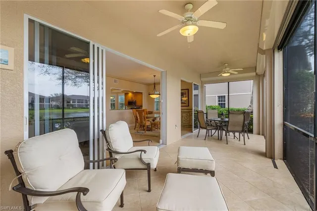 a living room with furniture a table and chairs