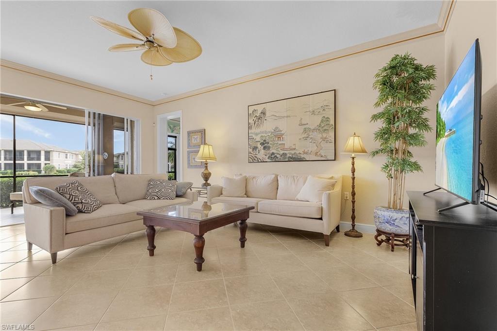 801 Regency Reserve Circle, Unit 4301 Naples, FL 34119 - Photo 2 of 26 a living room with furniture and a large window