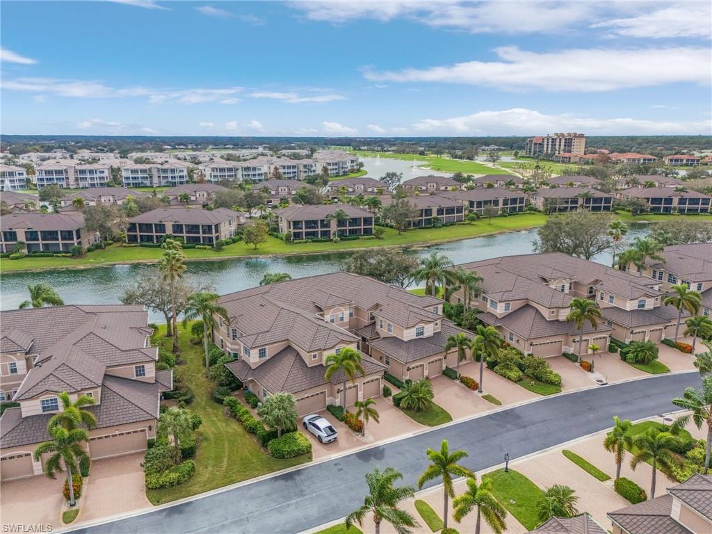 801 Regency Reserve Circle, Unit 4301 Naples, FL 34119 - Photo 24 of 26 an aerial view of a city with lots of residential buildings ocean and mountain view in back