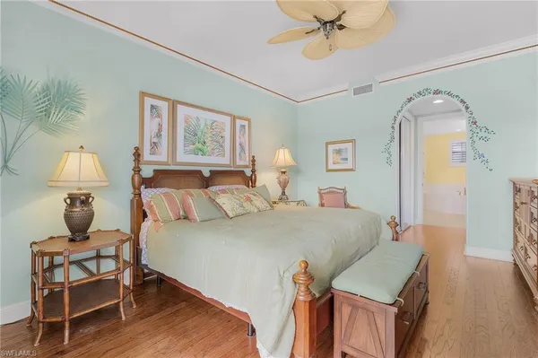 a bed room with a bed and a chandelier