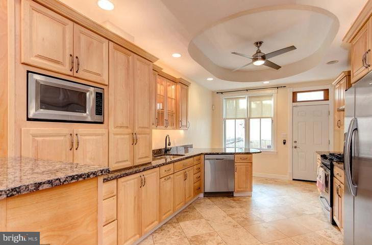 a view of a kitchen with a sink and a window