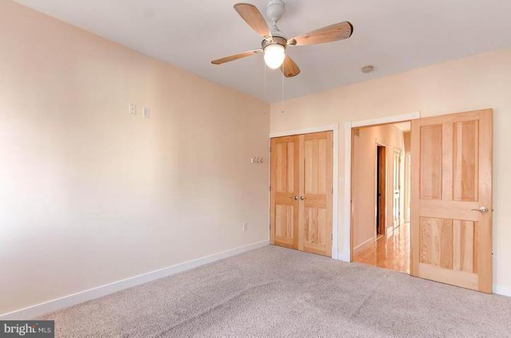 3403 Dillon Street Baltimore, MD 21224 - Photo 16 of 30 wooden floor in an empty room