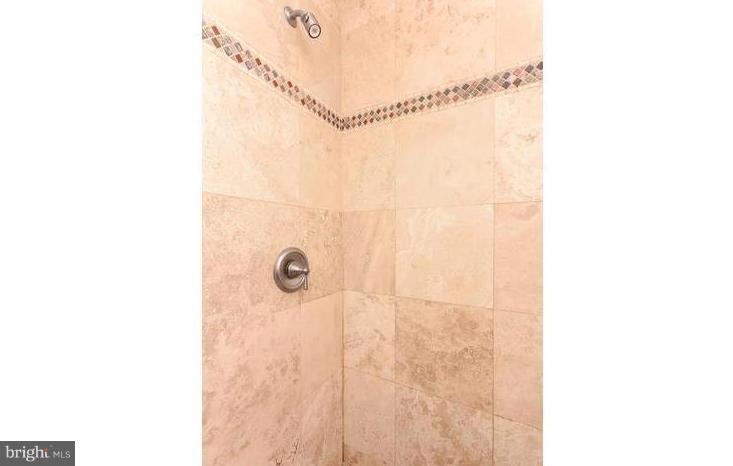 3403 Dillon Street Baltimore, MD 21224 - Photo 18 of 30 a bathroom with a shower